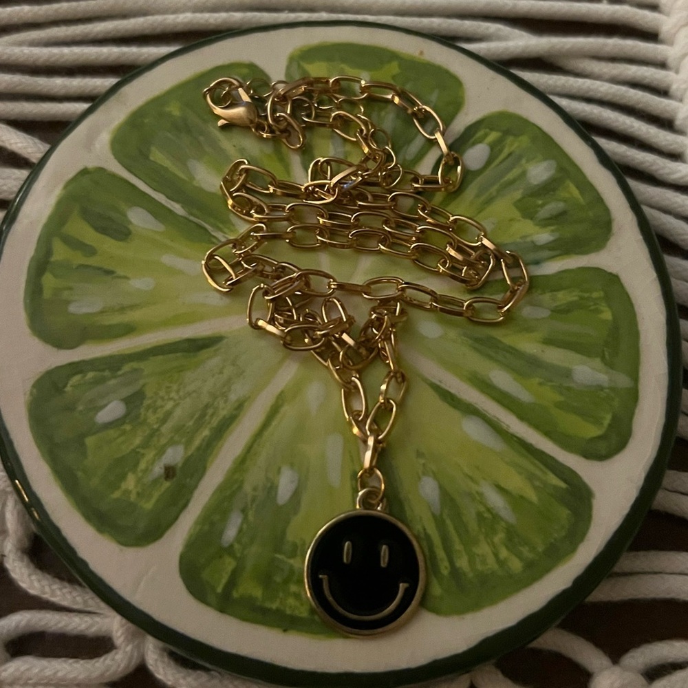 super cute gold and black smiley necklace